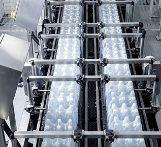 Bottles moving along a production conveyor