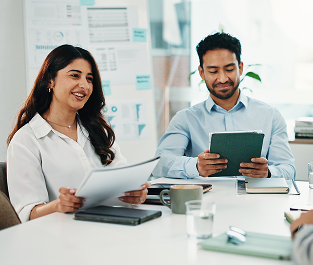 Recruiters reviewing candidate documents together