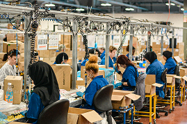 Workers packing orders on a busy fulfilment line