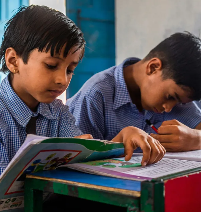 Schoolchildren reading at their desks